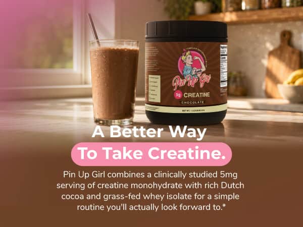 Pin Up Girl Wellness chocolate creatine supplement with a glass of shake.